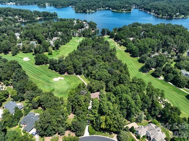 Nestled on the 6th green of The Old North State Club, 117 on Old North State Club at Uwharrie Point Golf community in North Carolina - for sale on GolfHomes.com, golf home, golf lot