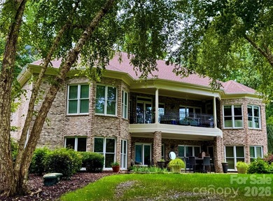 Nestled on the 6th green of The Old North State Club, 117 on Old North State Club at Uwharrie Point Golf community in North Carolina - for sale on GolfHomes.com, golf home, golf lot