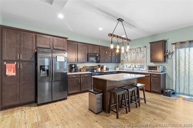 This beautiful 4-bedroom, 2.5-bath perfectly positioned on a on Woodlake Country Club in North Carolina - for sale on GolfHomes.com, golf home, golf lot