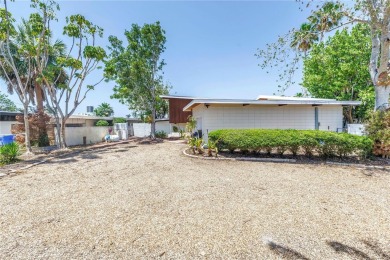 A unique, Mid-Century Modern home located on highly sought-after on Treasure Bay Golf and Tennis in Florida - for sale on GolfHomes.com, golf home, golf lot