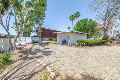 A unique, Mid-Century Modern home located on highly sought-after on Treasure Bay Golf and Tennis in Florida - for sale on GolfHomes.com, golf home, golf lot