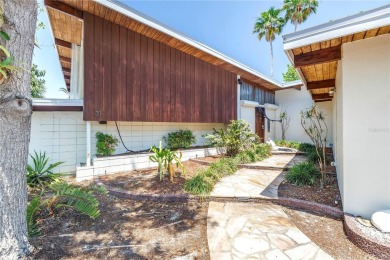 A unique, Mid-Century Modern home located on highly sought-after on Treasure Bay Golf and Tennis in Florida - for sale on GolfHomes.com, golf home, golf lot
