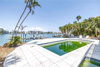 A unique, Mid-Century Modern home located on highly sought-after on Treasure Bay Golf and Tennis in Florida - for sale on GolfHomes.com, golf home, golf lot