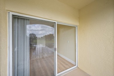 This spacious 3-bedroom, 2-bathroom with a lakeview balcony on Greenview Cove Golf Club in Florida - for sale on GolfHomes.com, golf home, golf lot