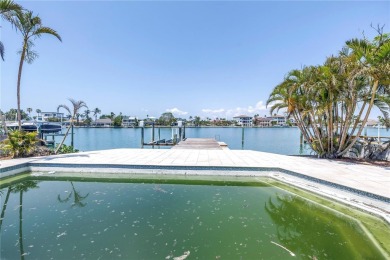 A unique, Mid-Century Modern home located on highly sought-after on Treasure Bay Golf and Tennis in Florida - for sale on GolfHomes.com, golf home, golf lot
