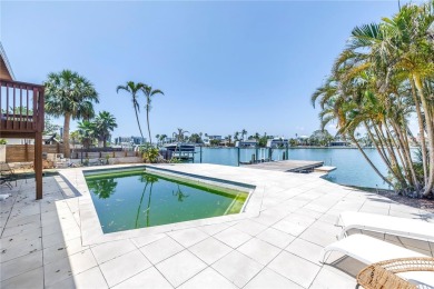 A unique, Mid-Century Modern home located on highly sought-after on Treasure Bay Golf and Tennis in Florida - for sale on GolfHomes.com, golf home, golf lot