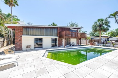 A unique, Mid-Century Modern home located on highly sought-after on Treasure Bay Golf and Tennis in Florida - for sale on GolfHomes.com, golf home, golf lot