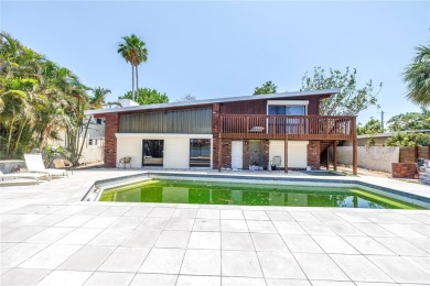 A unique, Mid-Century Modern home located on highly sought-after on Treasure Bay Golf and Tennis in Florida - for sale on GolfHomes.com, golf home, golf lot