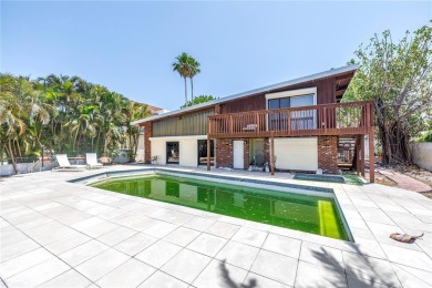 A unique, Mid-Century Modern home located on highly sought-after on Treasure Bay Golf and Tennis in Florida - for sale on GolfHomes.com, golf home, golf lot