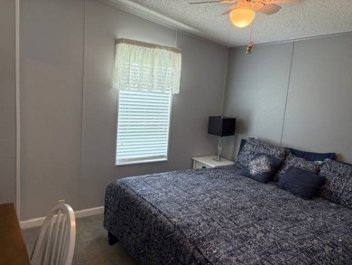 This home is in a 55 plus community with a monthly lot rent of on Crystal Lake Club in Florida - for sale on GolfHomes.com, golf home, golf lot