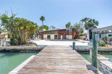 A unique, Mid-Century Modern home located on highly sought-after on Treasure Bay Golf and Tennis in Florida - for sale on GolfHomes.com, golf home, golf lot