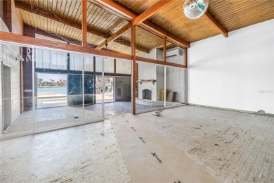 A unique, Mid-Century Modern home located on highly sought-after on Treasure Bay Golf and Tennis in Florida - for sale on GolfHomes.com, golf home, golf lot