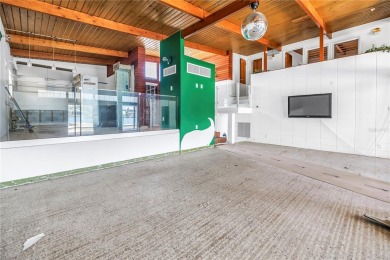 A unique, Mid-Century Modern home located on highly sought-after on Treasure Bay Golf and Tennis in Florida - for sale on GolfHomes.com, golf home, golf lot