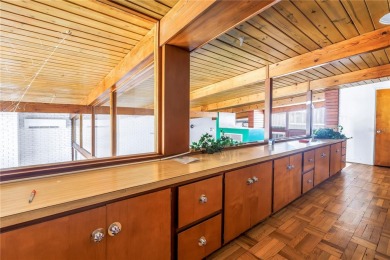 A unique, Mid-Century Modern home located on highly sought-after on Treasure Bay Golf and Tennis in Florida - for sale on GolfHomes.com, golf home, golf lot