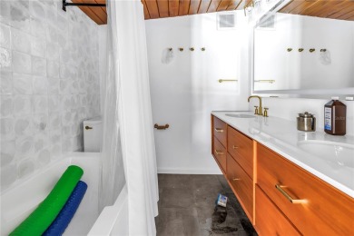 A unique, Mid-Century Modern home located on highly sought-after on Treasure Bay Golf and Tennis in Florida - for sale on GolfHomes.com, golf home, golf lot