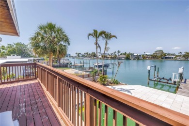 A unique, Mid-Century Modern home located on highly sought-after on Treasure Bay Golf and Tennis in Florida - for sale on GolfHomes.com, golf home, golf lot