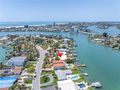 A unique, Mid-Century Modern home located on highly sought-after on Treasure Bay Golf and Tennis in Florida - for sale on GolfHomes.com, golf home, golf lot