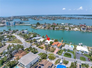 A unique, Mid-Century Modern home located on highly sought-after on Treasure Bay Golf and Tennis in Florida - for sale on GolfHomes.com, golf home, golf lot