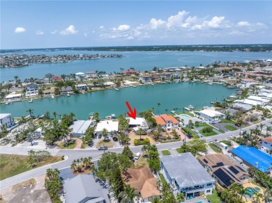 A unique, Mid-Century Modern home located on highly sought-after on Treasure Bay Golf and Tennis in Florida - for sale on GolfHomes.com, golf home, golf lot