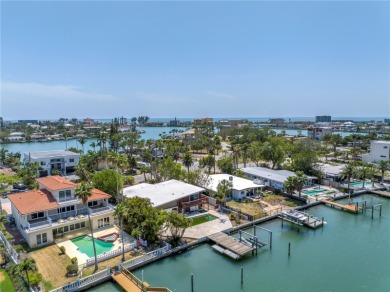 A unique, Mid-Century Modern home located on highly sought-after on Treasure Bay Golf and Tennis in Florida - for sale on GolfHomes.com, golf home, golf lot