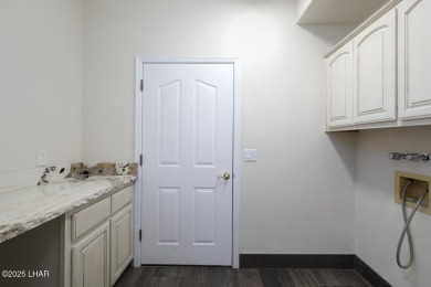 Take a look at this BEAUTIFUL home right on the Lake Havasu Golf on London Bridge Golf Course in Arizona - for sale on GolfHomes.com, golf home, golf lot