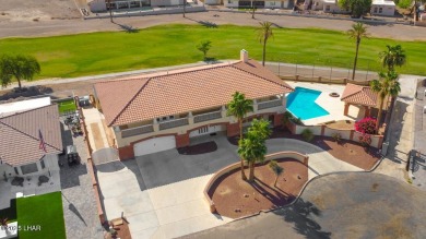 Take a look at this BEAUTIFUL home right on the Lake Havasu Golf on London Bridge Golf Course in Arizona - for sale on GolfHomes.com, golf home, golf lot