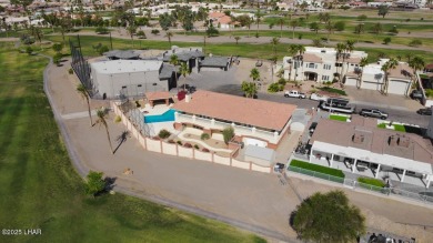 Take a look at this BEAUTIFUL home right on the Lake Havasu Golf on London Bridge Golf Course in Arizona - for sale on GolfHomes.com, golf home, golf lot