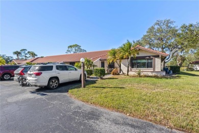 THIS GORGEOUS END UNIT TURN KEY WATER VIEW VILLA HAS BEEN on Palm Aire Country Club of Sarasota in Florida - for sale on GolfHomes.com, golf home, golf lot