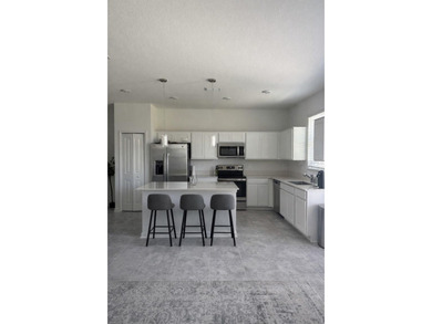 Welcome to this stunning 4-bedroom, 3.5-bath modern residence on National Golf Course in Florida - for sale on GolfHomes.com, golf home, golf lot