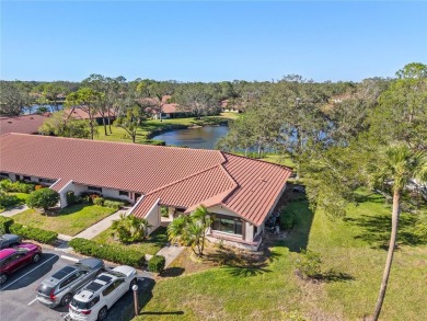 THIS GORGEOUS END UNIT TURN KEY WATER VIEW VILLA HAS BEEN on Palm Aire Country Club of Sarasota in Florida - for sale on GolfHomes.com, golf home, golf lot