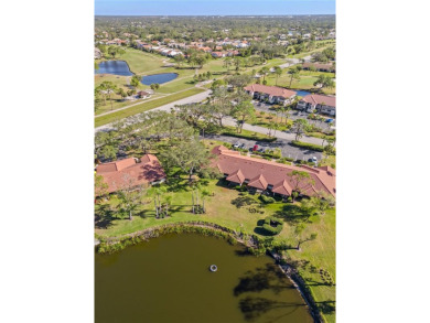 THIS GORGEOUS END UNIT TURN KEY WATER VIEW VILLA HAS BEEN on Palm Aire Country Club of Sarasota in Florida - for sale on GolfHomes.com, golf home, golf lot