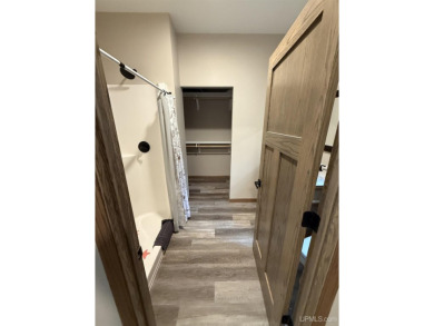 This is still like a brand new home! Seller bought in 2023 and on Portage Lake Golf Course in Michigan - for sale on GolfHomes.com, golf home, golf lot