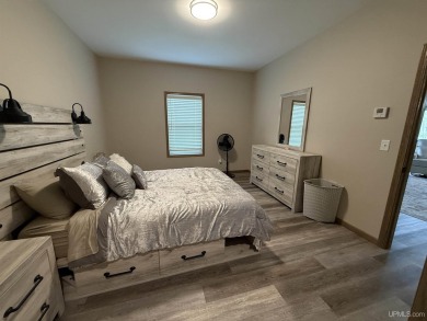 This is still like a brand new home! Seller bought in 2023 and on Portage Lake Golf Course in Michigan - for sale on GolfHomes.com, golf home, golf lot