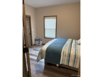 This is still like a brand new home! Seller bought in 2023 and on Portage Lake Golf Course in Michigan - for sale on GolfHomes.com, golf home, golf lot
