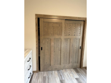This is still like a brand new home! Seller bought in 2023 and on Portage Lake Golf Course in Michigan - for sale on GolfHomes.com, golf home, golf lot