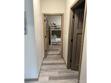 This is still like a brand new home! Seller bought in 2023 and on Portage Lake Golf Course in Michigan - for sale on GolfHomes.com, golf home, golf lot