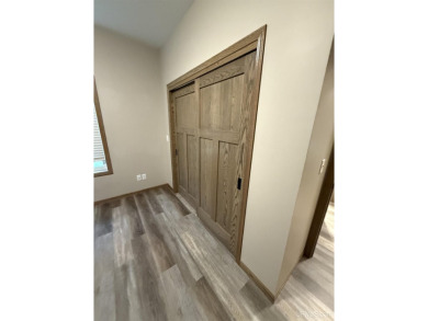This is still like a brand new home! Seller bought in 2023 and on Portage Lake Golf Course in Michigan - for sale on GolfHomes.com, golf home, golf lot