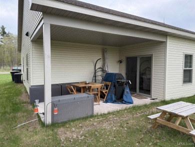 This is still like a brand new home! Seller bought in 2023 and on Portage Lake Golf Course in Michigan - for sale on GolfHomes.com, golf home, golf lot