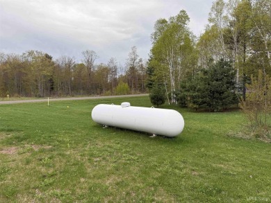 This is still like a brand new home! Seller bought in 2023 and on Portage Lake Golf Course in Michigan - for sale on GolfHomes.com, golf home, golf lot