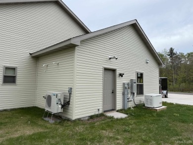 This is still like a brand new home! Seller bought in 2023 and on Portage Lake Golf Course in Michigan - for sale on GolfHomes.com, golf home, golf lot