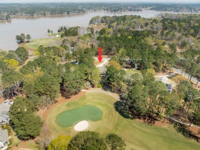 Nestled gracefully on the picturesque 10th hole of the renowned on Reynolds Lake Oconee - Great Waters Course in Georgia - for sale on GolfHomes.com, golf home, golf lot