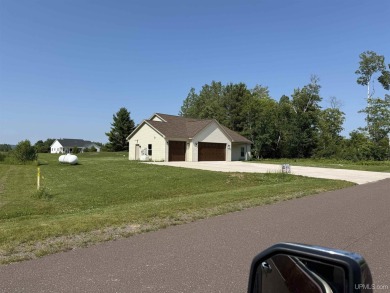 This is still like a brand new home! Seller bought in 2023 and on Portage Lake Golf Course in Michigan - for sale on GolfHomes.com, golf home, golf lot