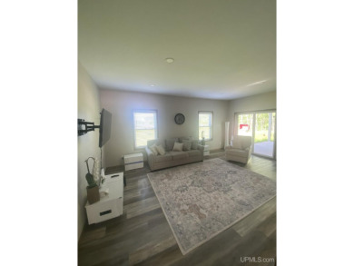 This is still like a brand new home! Seller bought in 2023 and on Portage Lake Golf Course in Michigan - for sale on GolfHomes.com, golf home, golf lot
