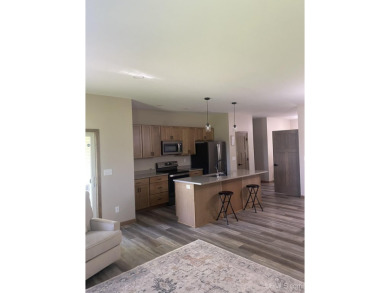 This is still like a brand new home! Seller bought in 2023 and on Portage Lake Golf Course in Michigan - for sale on GolfHomes.com, golf home, golf lot