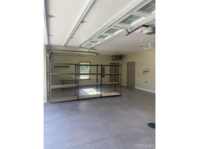 This is still like a brand new home! Seller bought in 2023 and on Portage Lake Golf Course in Michigan - for sale on GolfHomes.com, golf home, golf lot