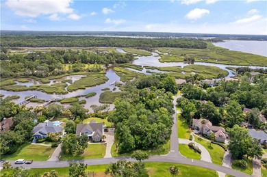 Nestled on a corner lot in the sought-after Oak Grove Island on Oak Grove Island Golf and Country Club in Georgia - for sale on GolfHomes.com, golf home, golf lot