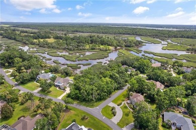 Nestled on a corner lot in the sought-after Oak Grove Island on Oak Grove Island Golf and Country Club in Georgia - for sale on GolfHomes.com, golf home, golf lot