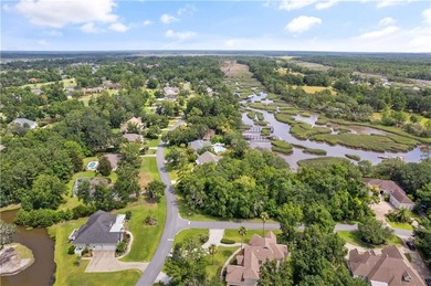 Nestled on a corner lot in the sought-after Oak Grove Island on Oak Grove Island Golf and Country Club in Georgia - for sale on GolfHomes.com, golf home, golf lot