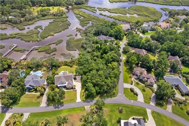Nestled on a corner lot in the sought-after Oak Grove Island on Oak Grove Island Golf and Country Club in Georgia - for sale on GolfHomes.com, golf home, golf lot