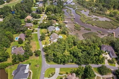 Nestled on a corner lot in the sought-after Oak Grove Island on Oak Grove Island Golf and Country Club in Georgia - for sale on GolfHomes.com, golf home, golf lot